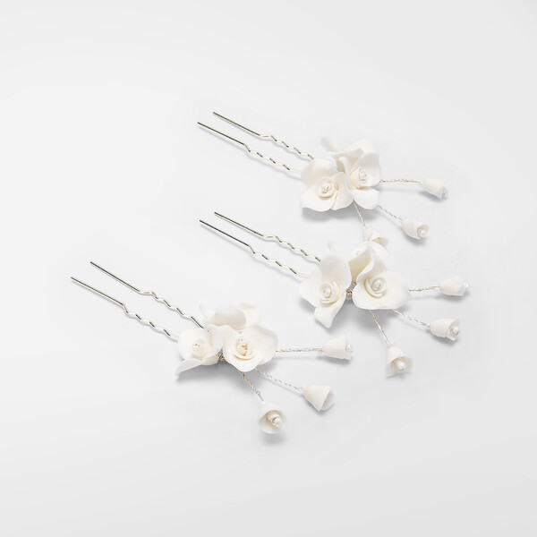 Forcine con fiori in porcellana